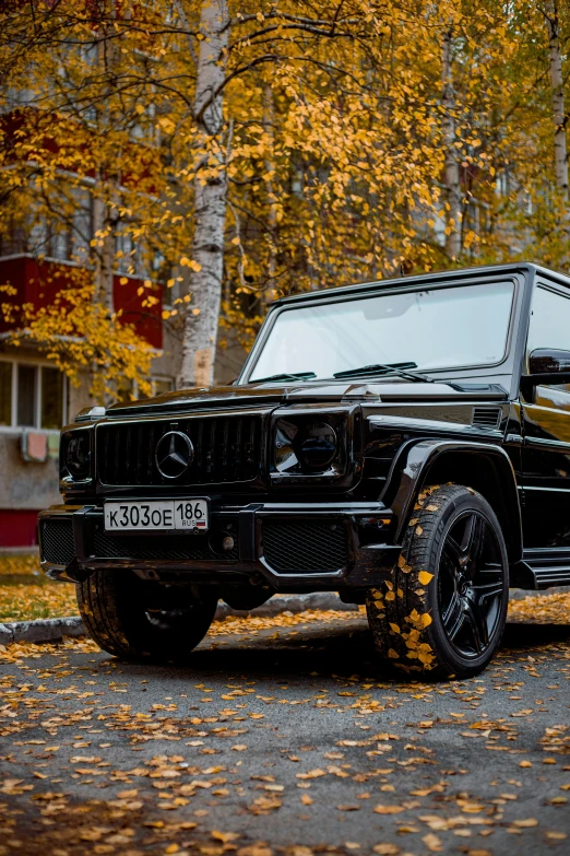 the black suv is parked in the driveway