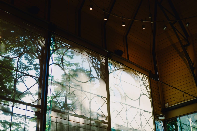 the wall behind a window with a view of trees