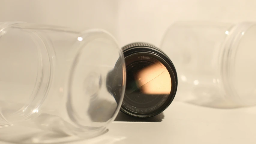 lens sitting in the side of plastic cups