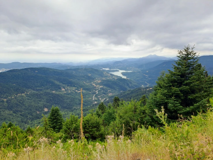 view down into a valley from top of a mountain