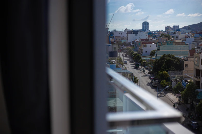 a city skyline is seen through the window