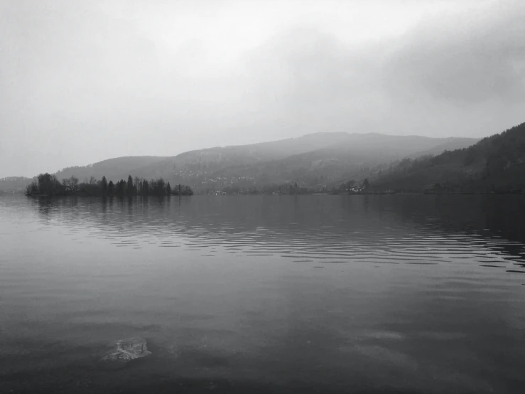 there is some water and trees in the mountains