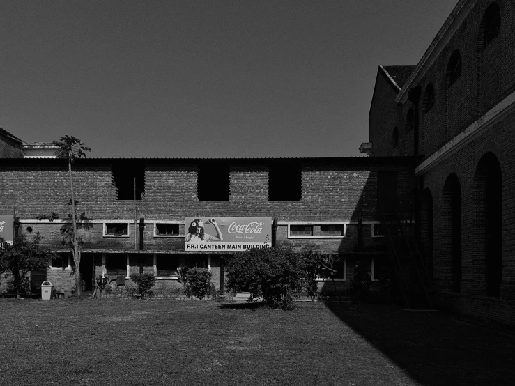 a black and white po of an old building with the sign closed