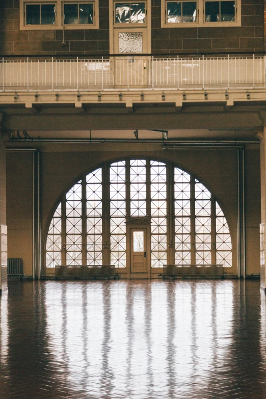 a hallway inside of a building with a large doorway