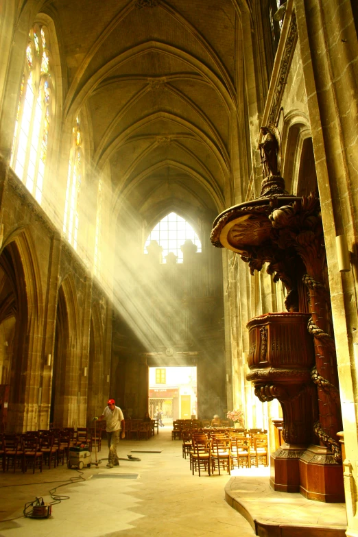 the light comes through the window into a church