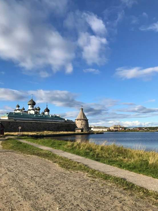 an image of a large building that is beside water