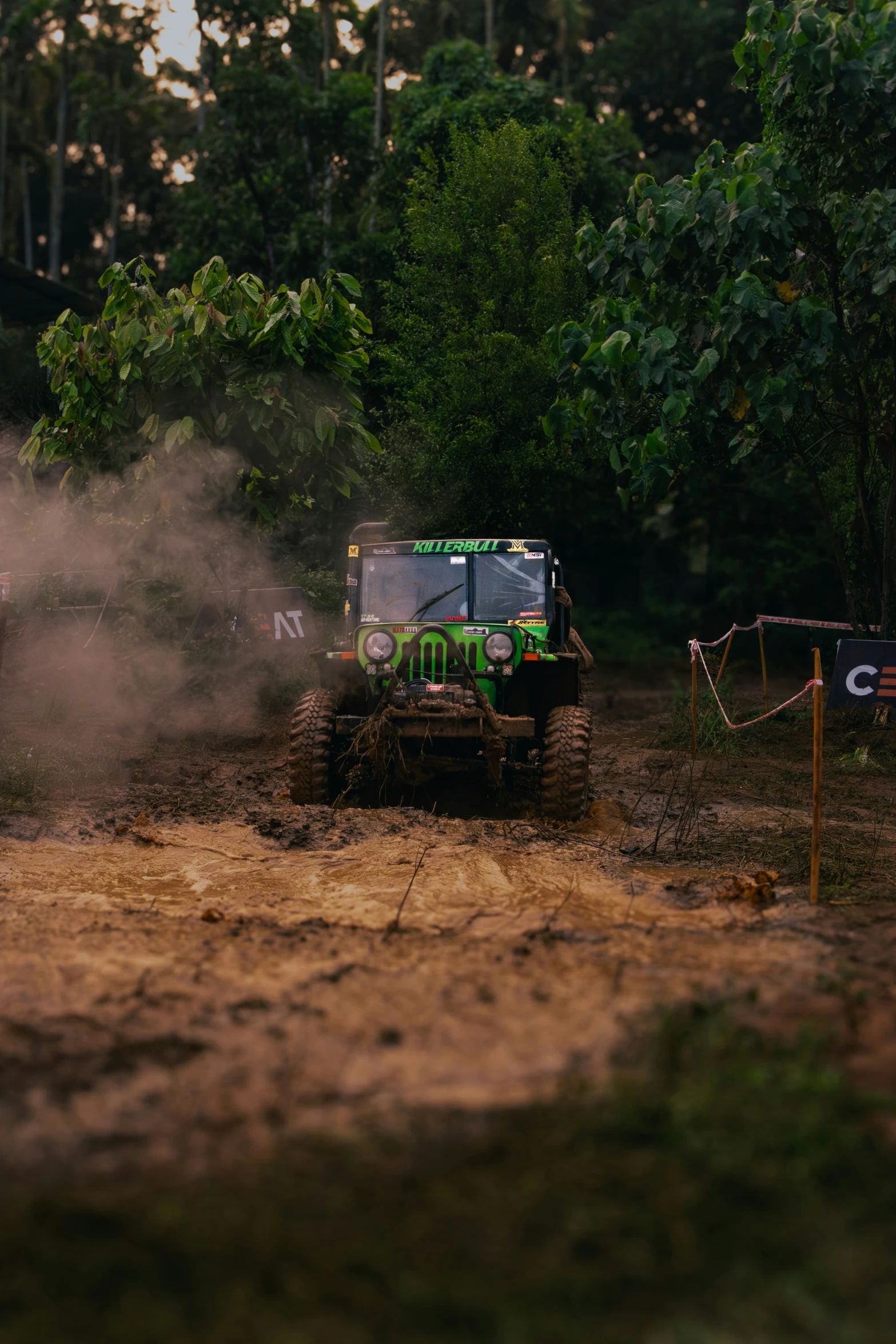 a tractor moving on dirt with trees in the background