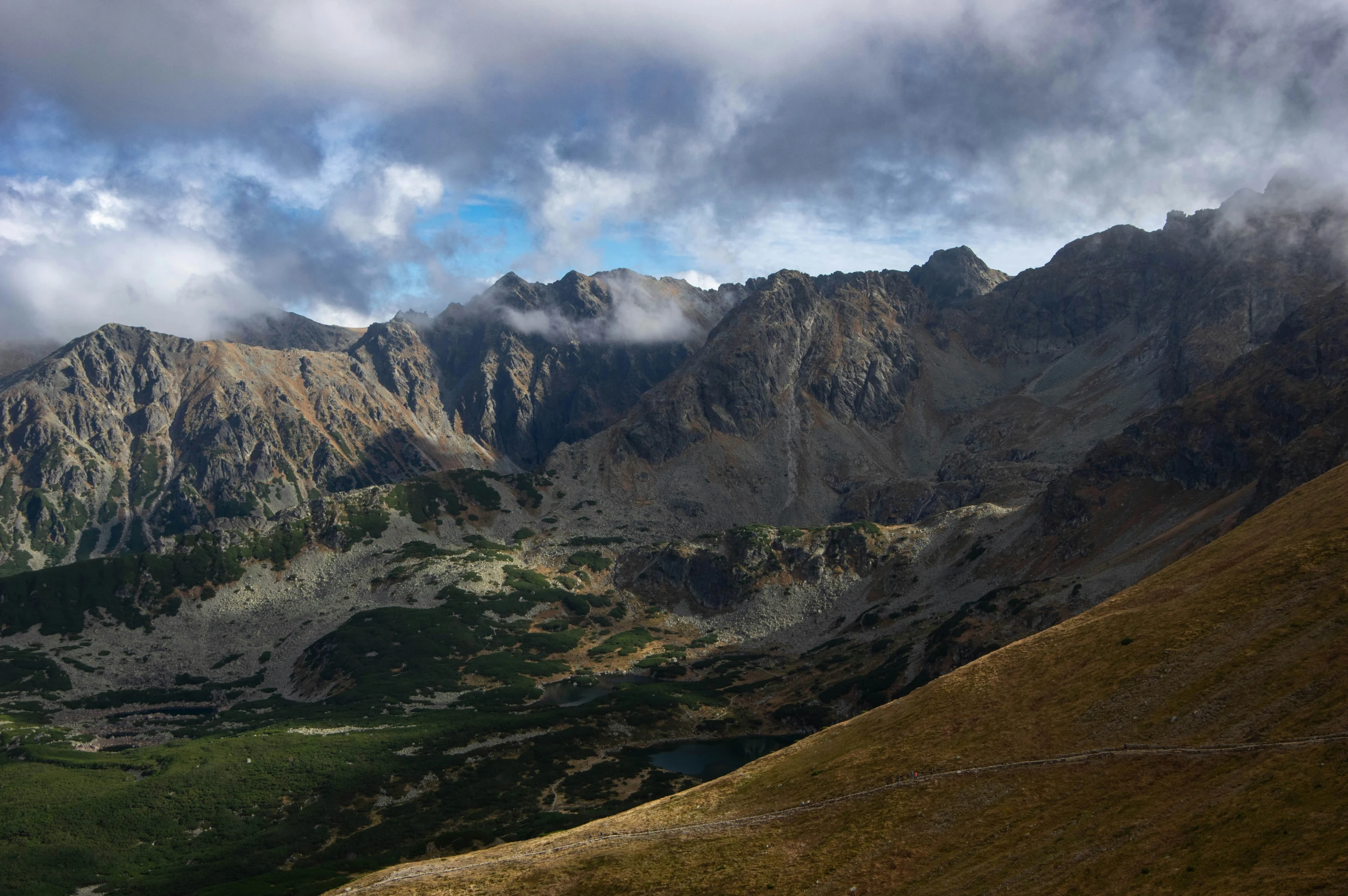 clouds loom over the mountains at this viewpoint