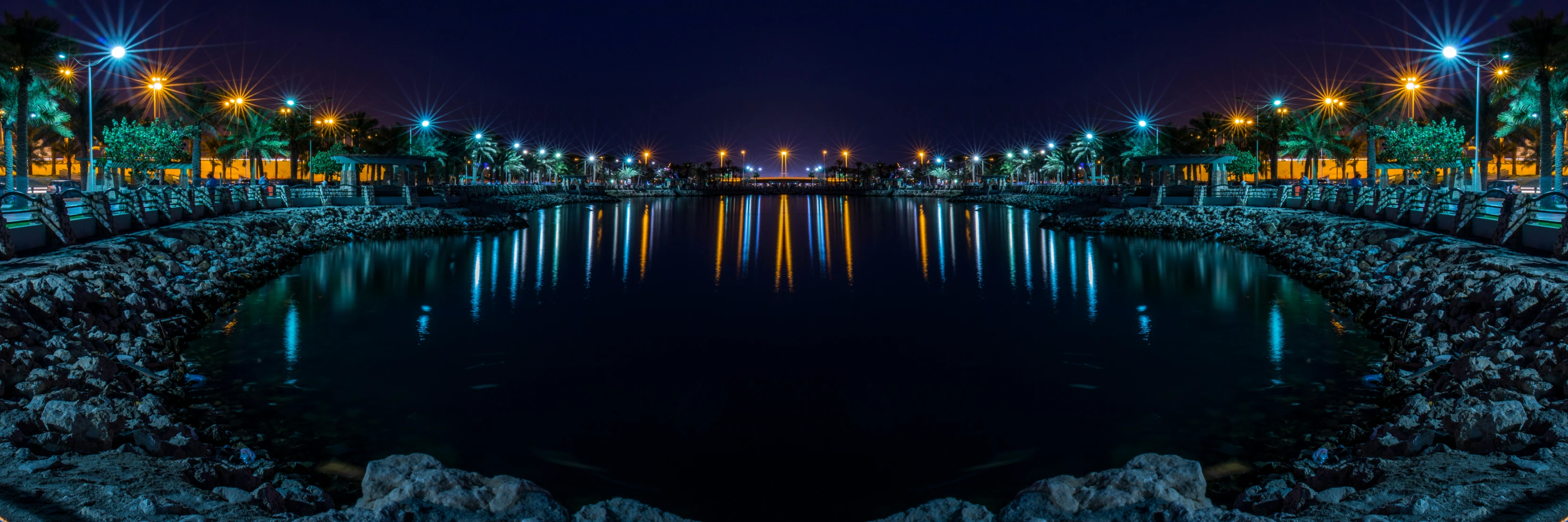 night view of a bridge over a large lake