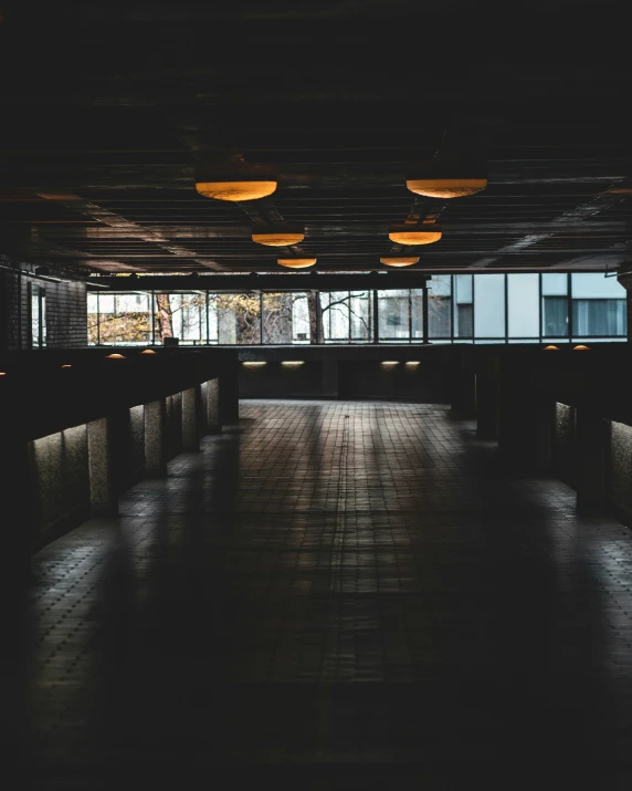 an empty parking garage is pictured with lights in it