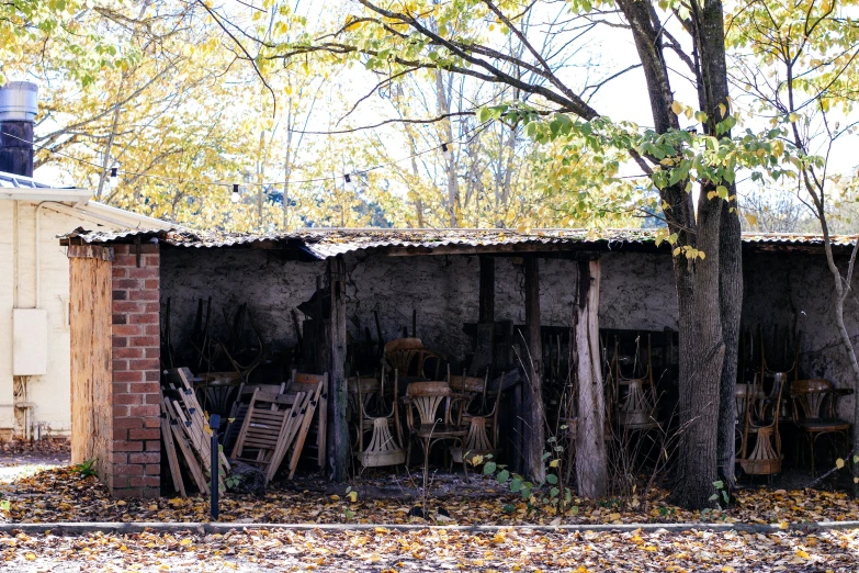 a building with a pile of old objects outside of it