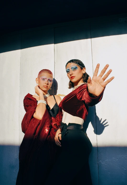 two young women posing with their arms around each other