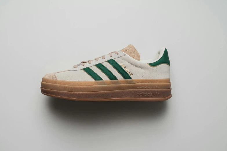 the adidas in white and green is on display