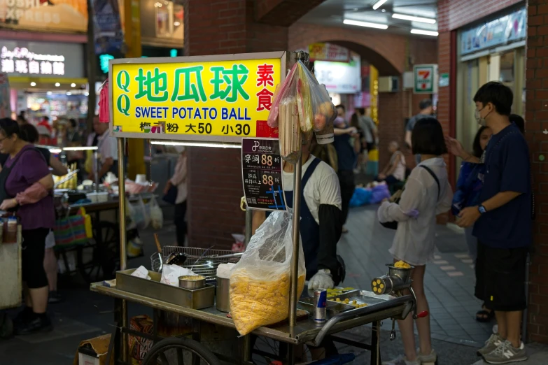 an asian food cart selling a variety of items