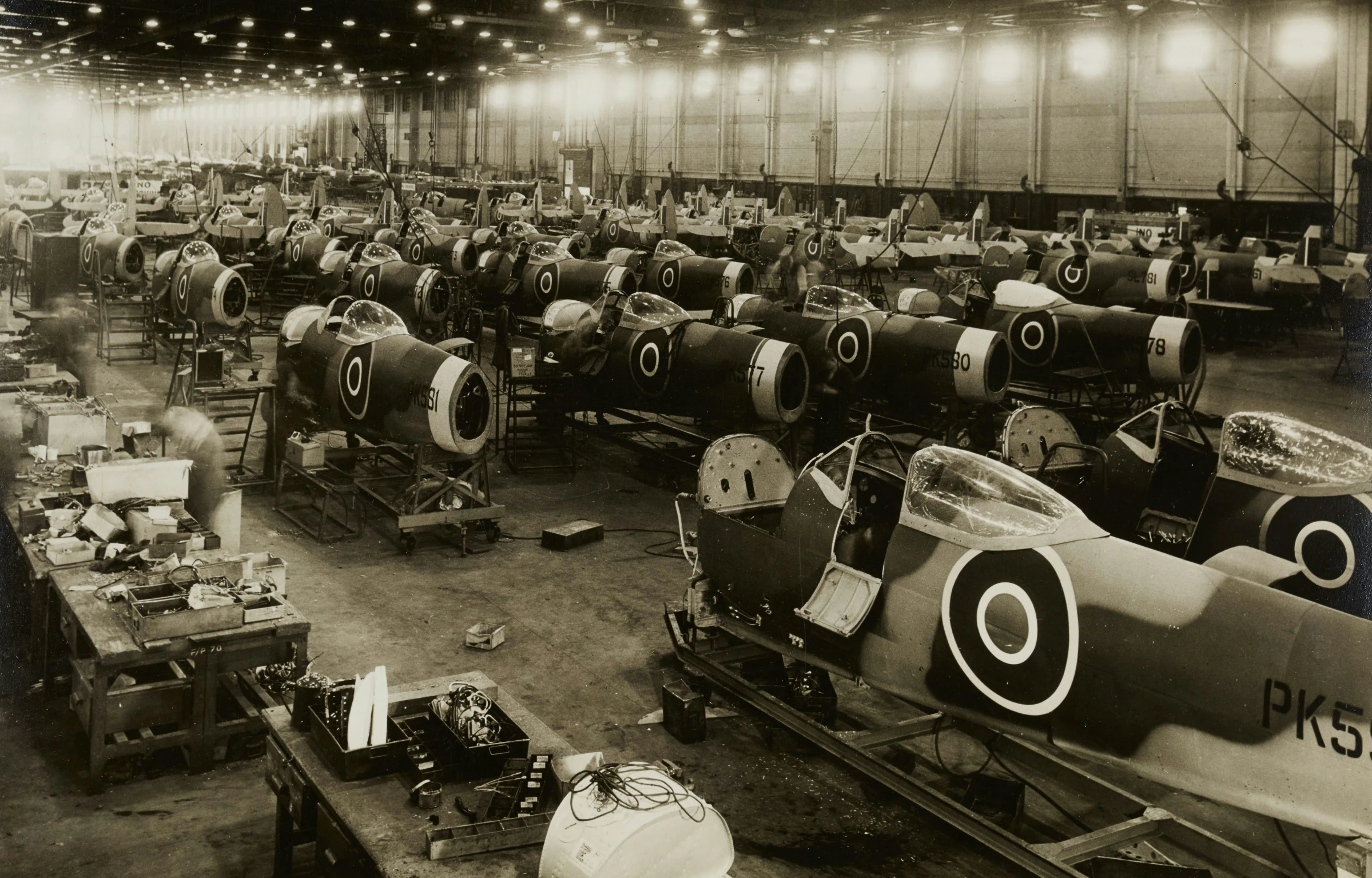 a group of air planes in a hangar