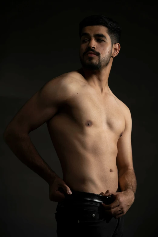 man in dark underwear posing for a portrait