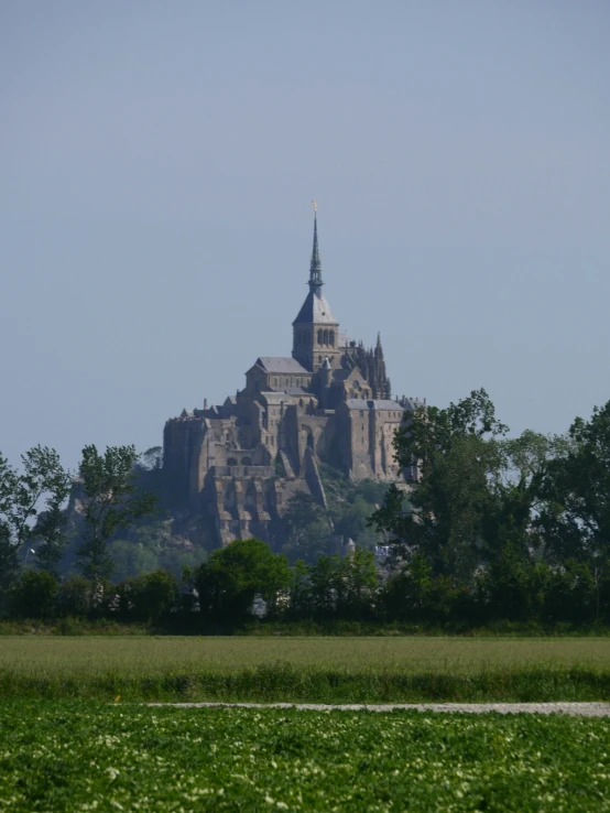 a huge castle sitting on top of a hill