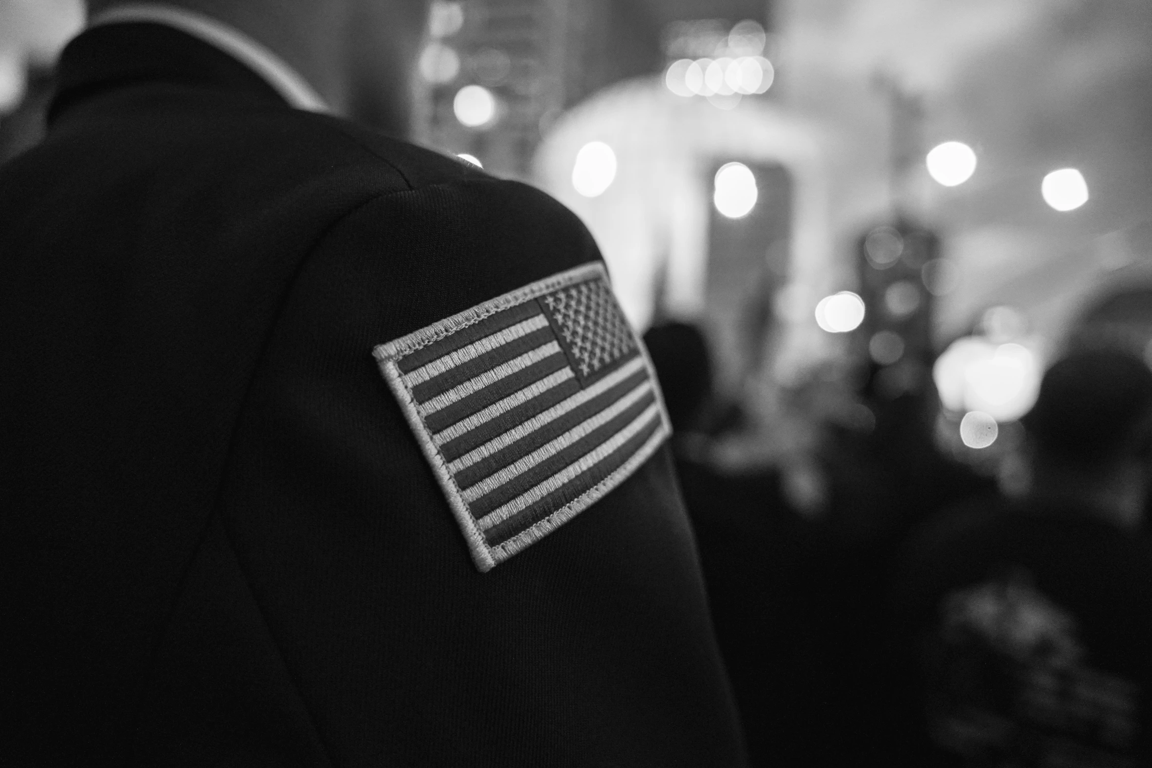 an american flag embroidered on the back of a jacket