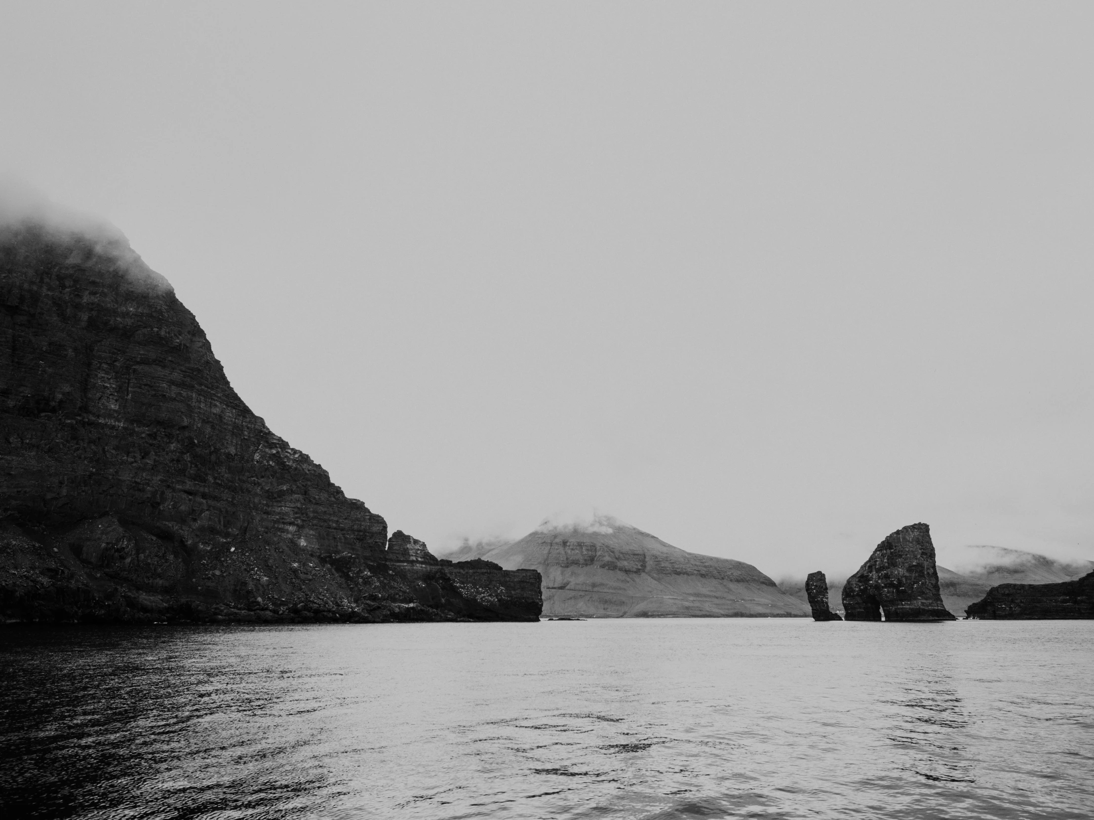 a boat sails in a small body of water