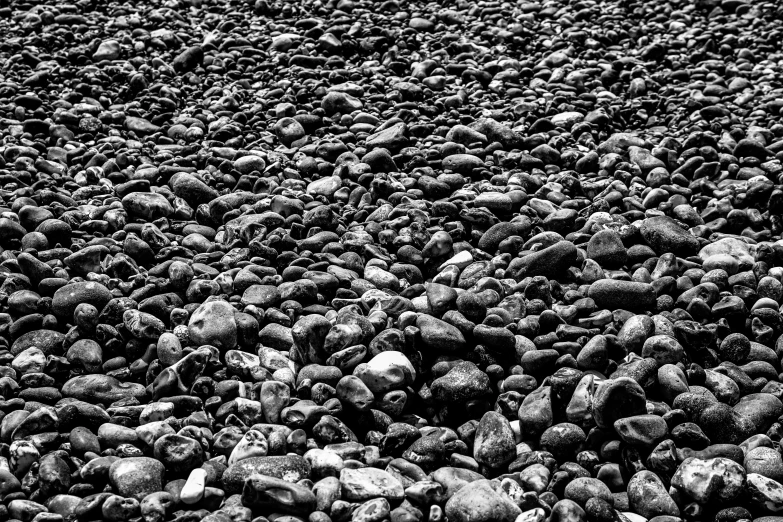 black rocks are stacked up close together