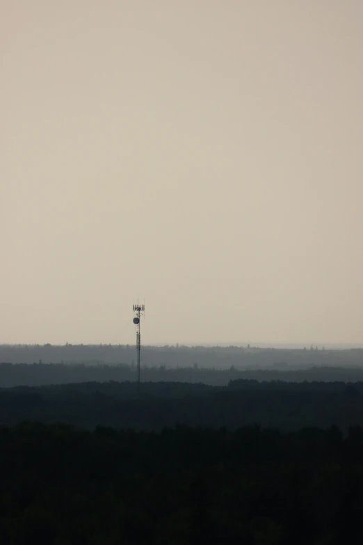 an airplane is flying over a dirt field