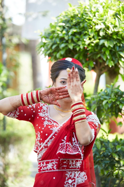 a woman in a red dress is making a face