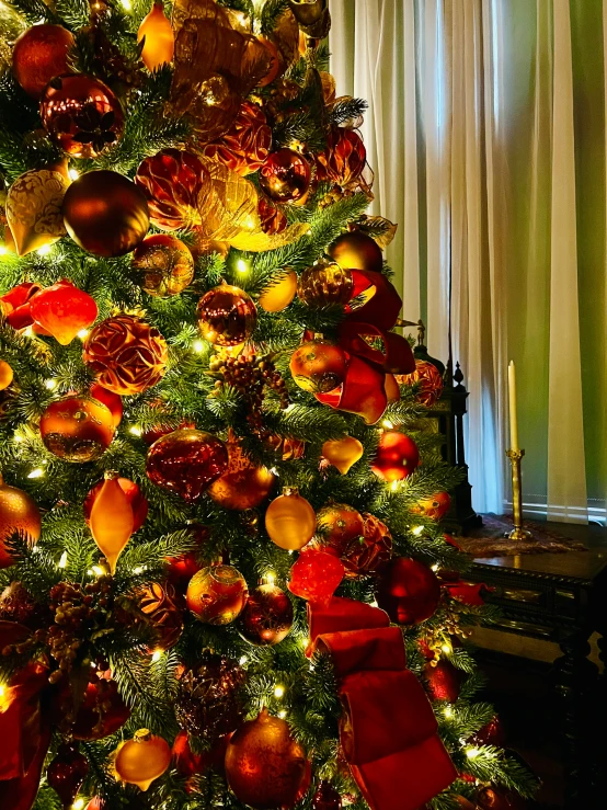 a lighted christmas tree in a living room
