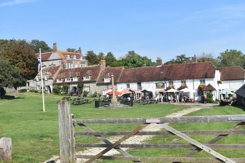 a very large field full of tables and people