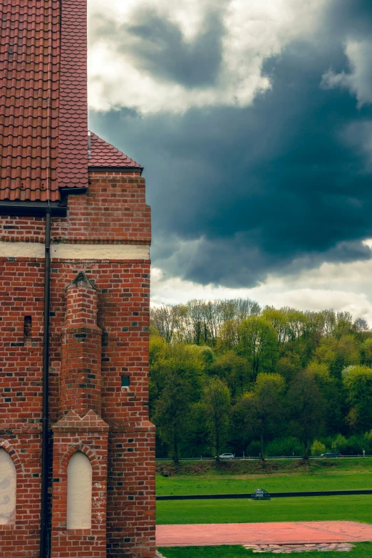 an old red brick building with a clock tower