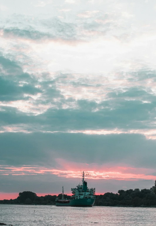 the sky is filled with cloud cover as the ships are in port