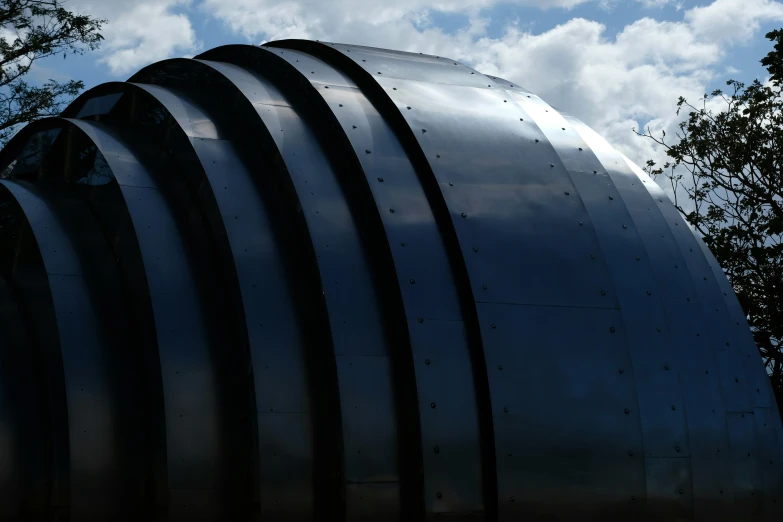 a metal structure with a curved top on it