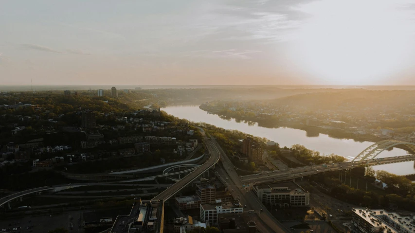 a river that runs over a bridge and into the sky