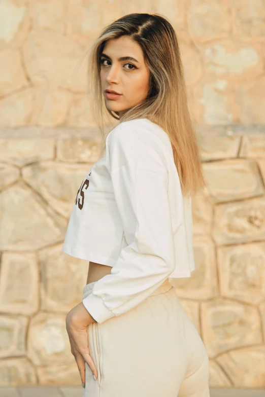 a woman in high heels posing for a picture