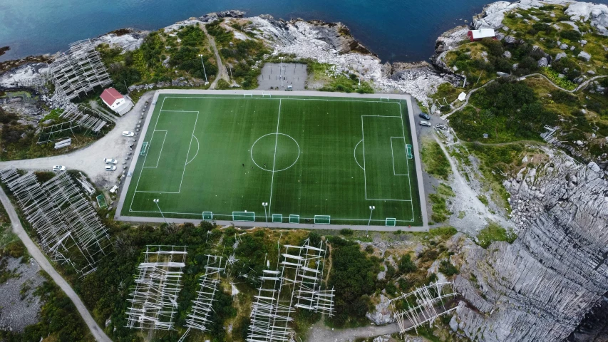 an aerial view of a soccer field in the middle of nowhere