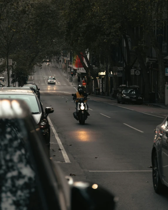 a motorcycle on a city street at dusk