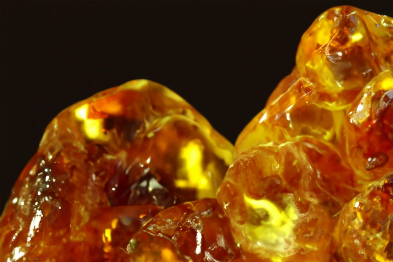 some very bright colored rocks sitting in the dark