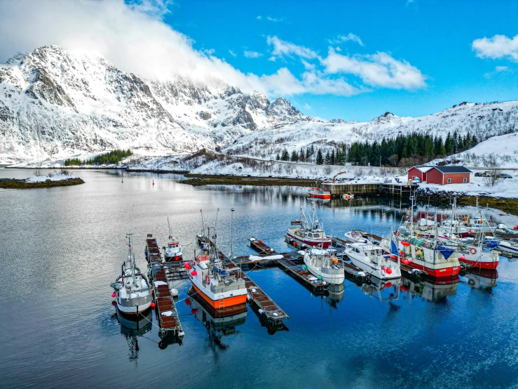 the boats are docked in the harbor of the fishing village