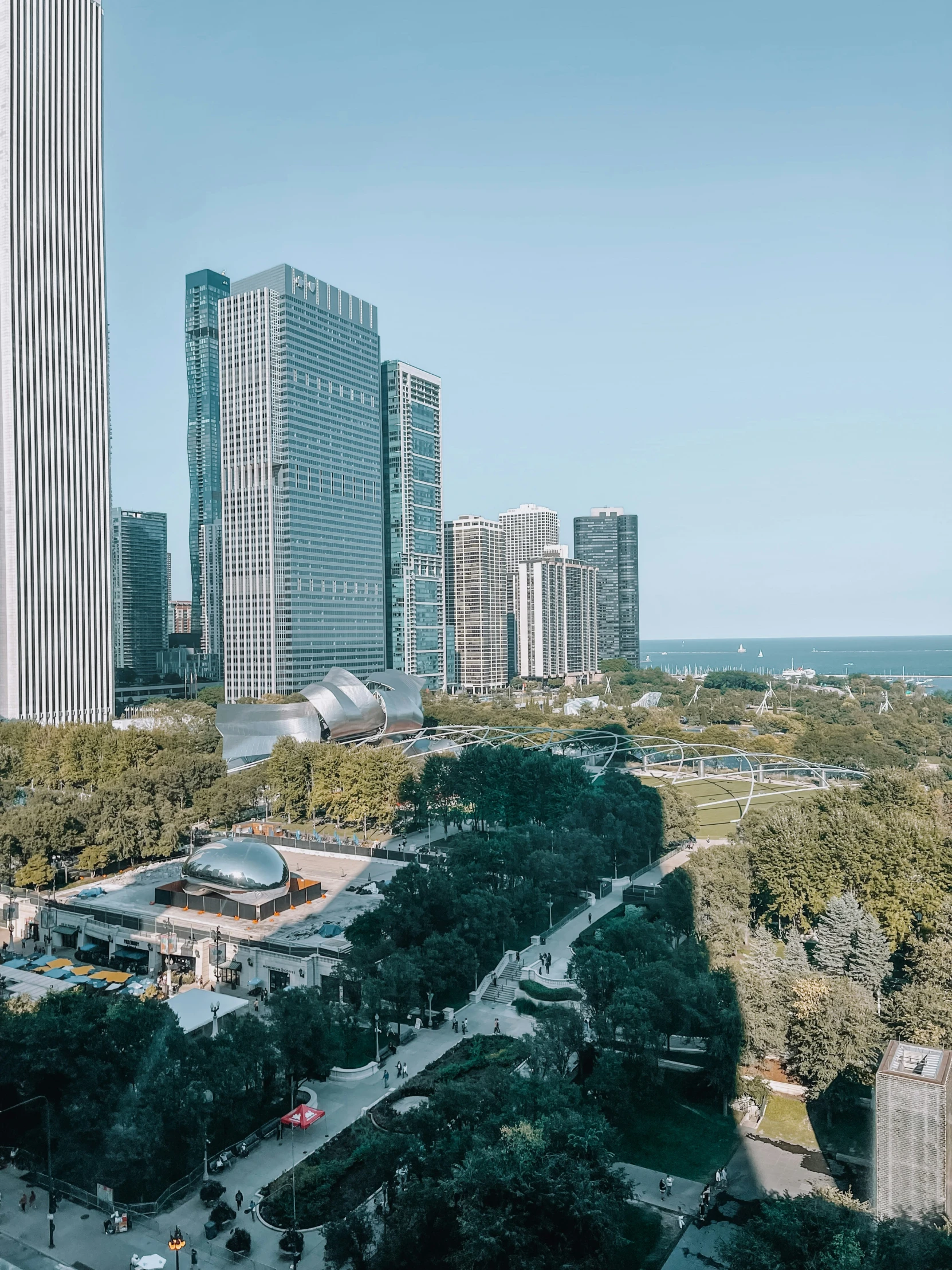 an aerial view of some tall buildings and trees