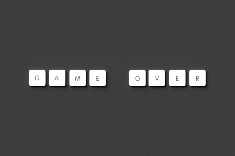 computer keyboard keys spelling game over on a dark surface
