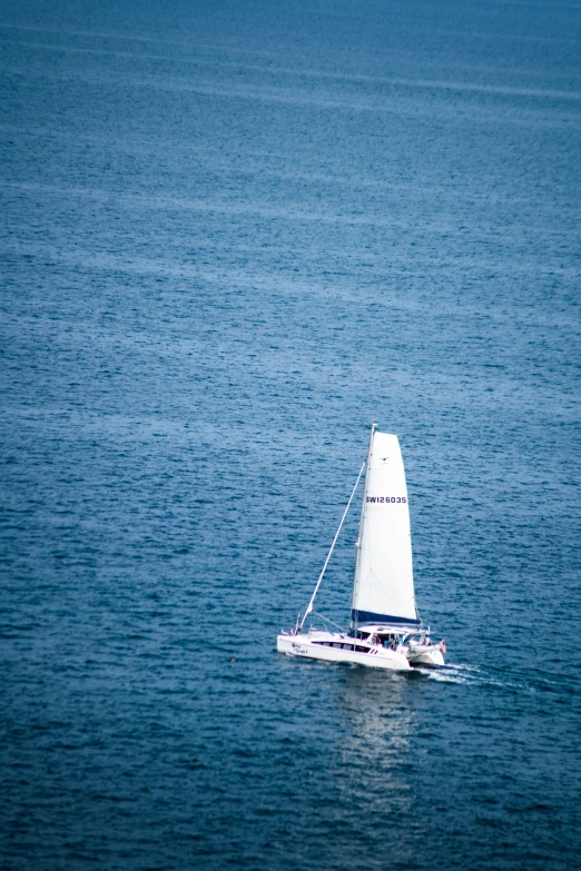 the sailboat is sailing across the water