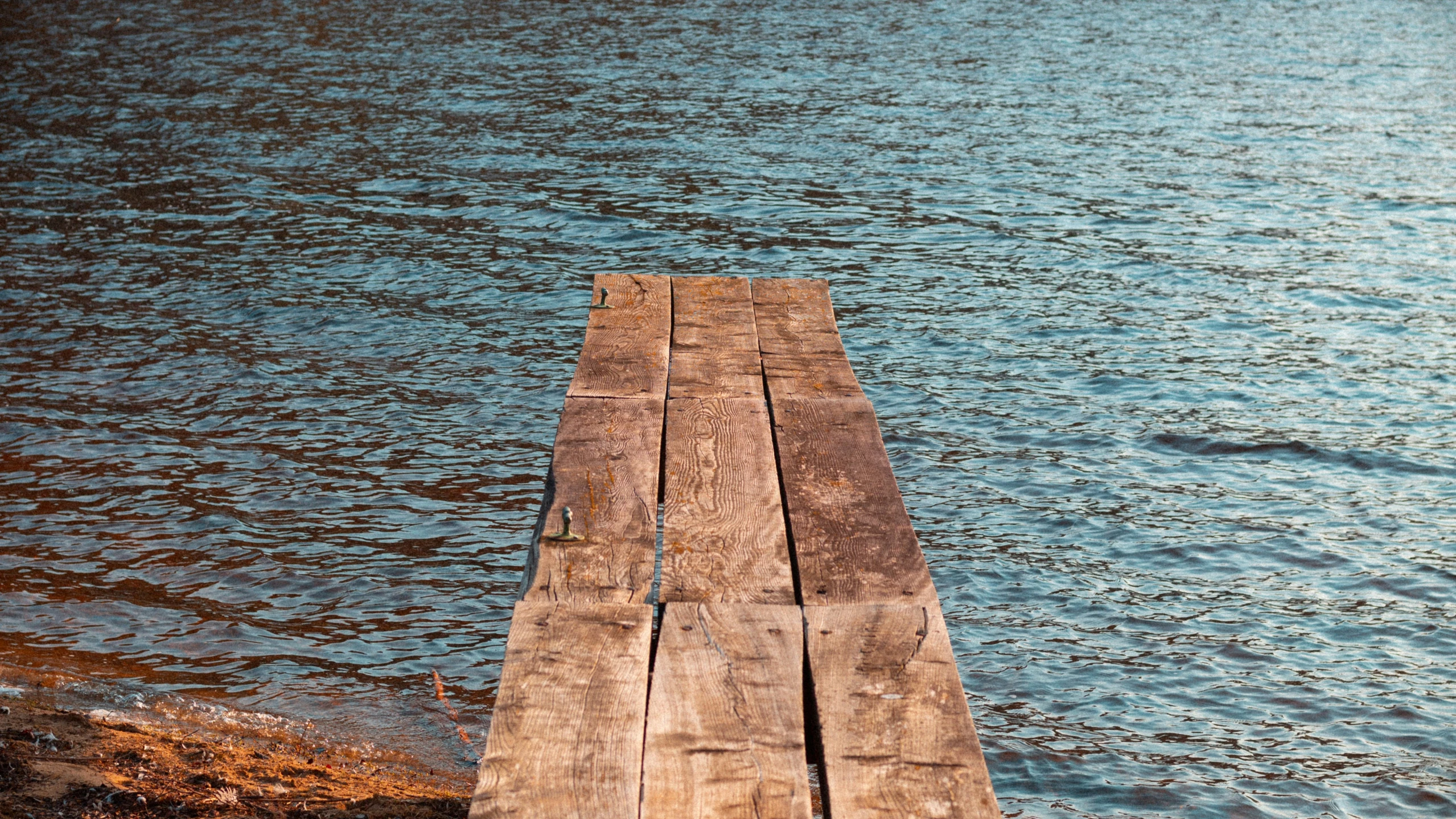 a close up of a dock in the water