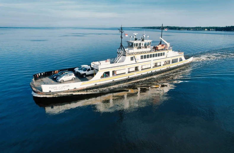 a large boat with lots of passengers sailing on the water