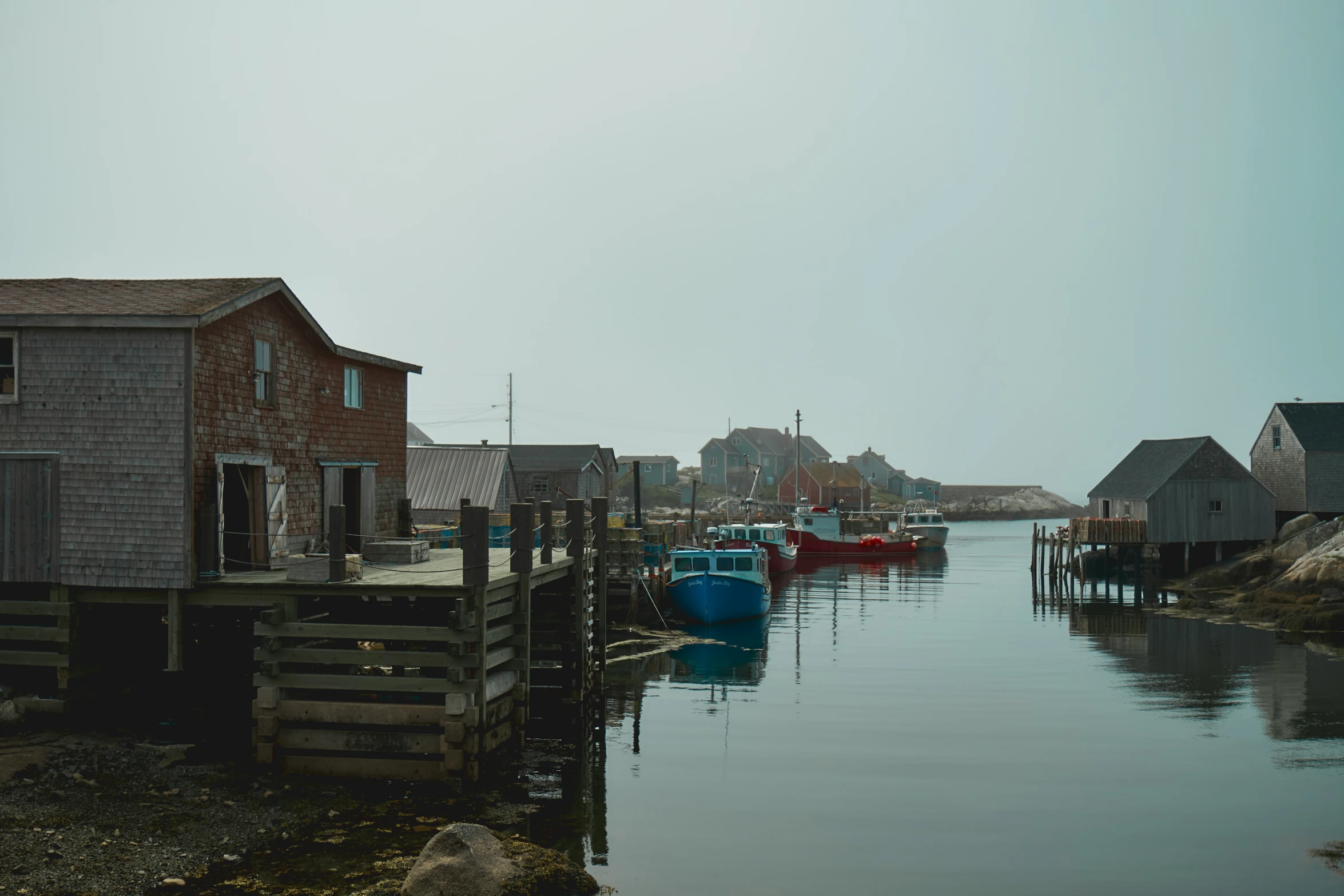 a body of water next to a group of buildings