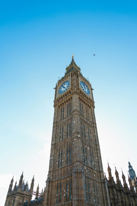 a large cathedral designed clock tower towering over a city