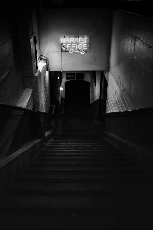 an underground staircase leading into a subway