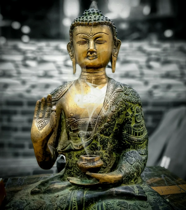 buddha statue with water fountain in foreground