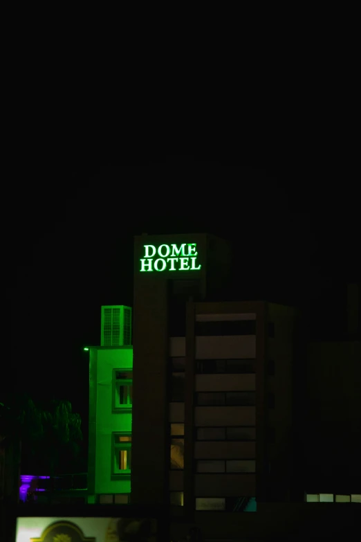 a el sign lit up at night in the city