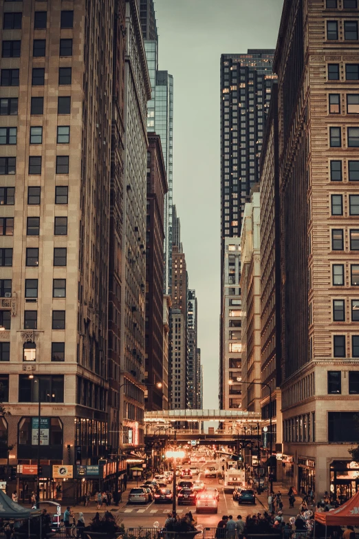 a busy city street has some very tall buildings