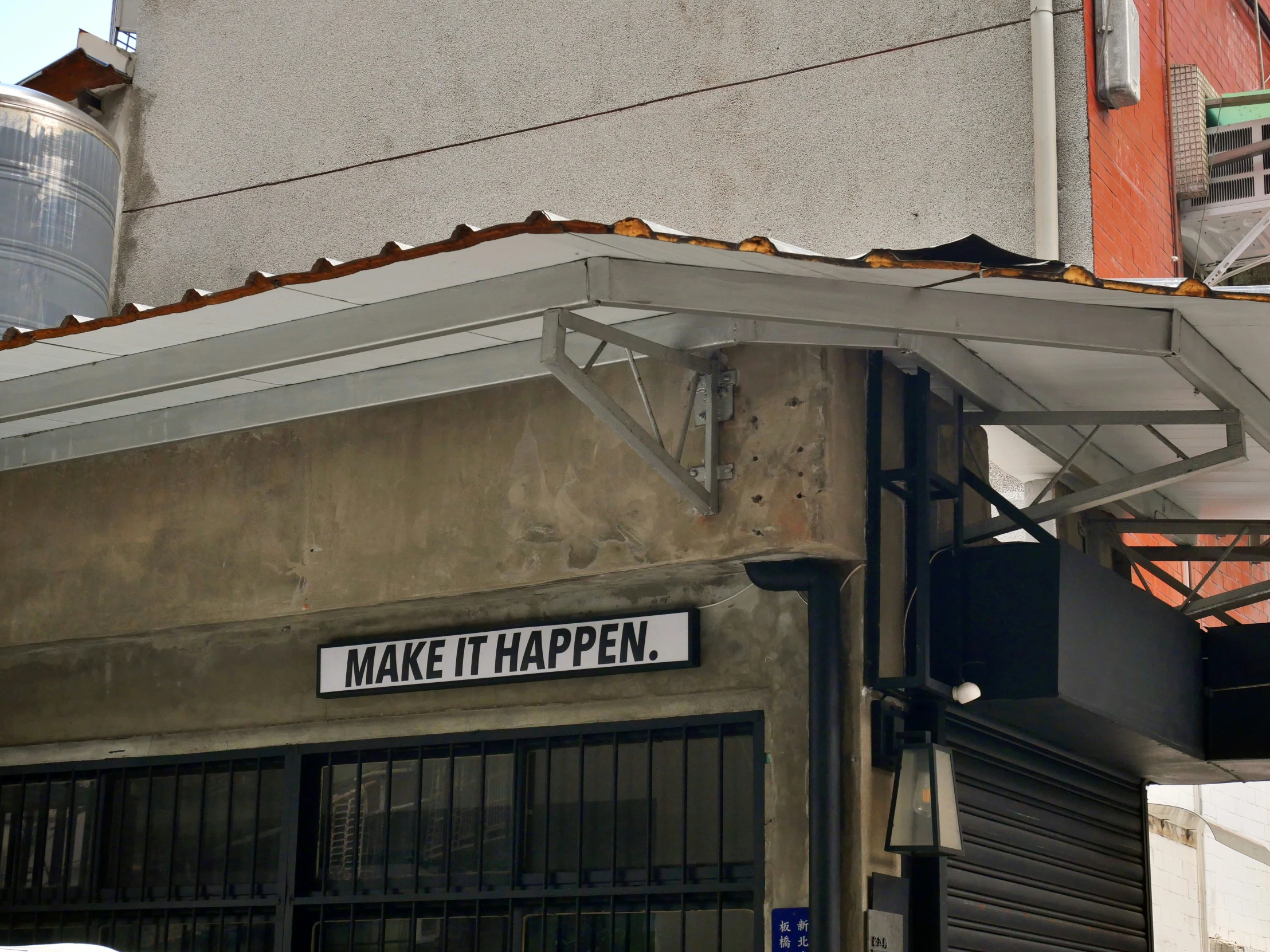 a street sign is hanging up outside a building