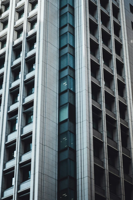 two building facing away from each other with a sky line and cars